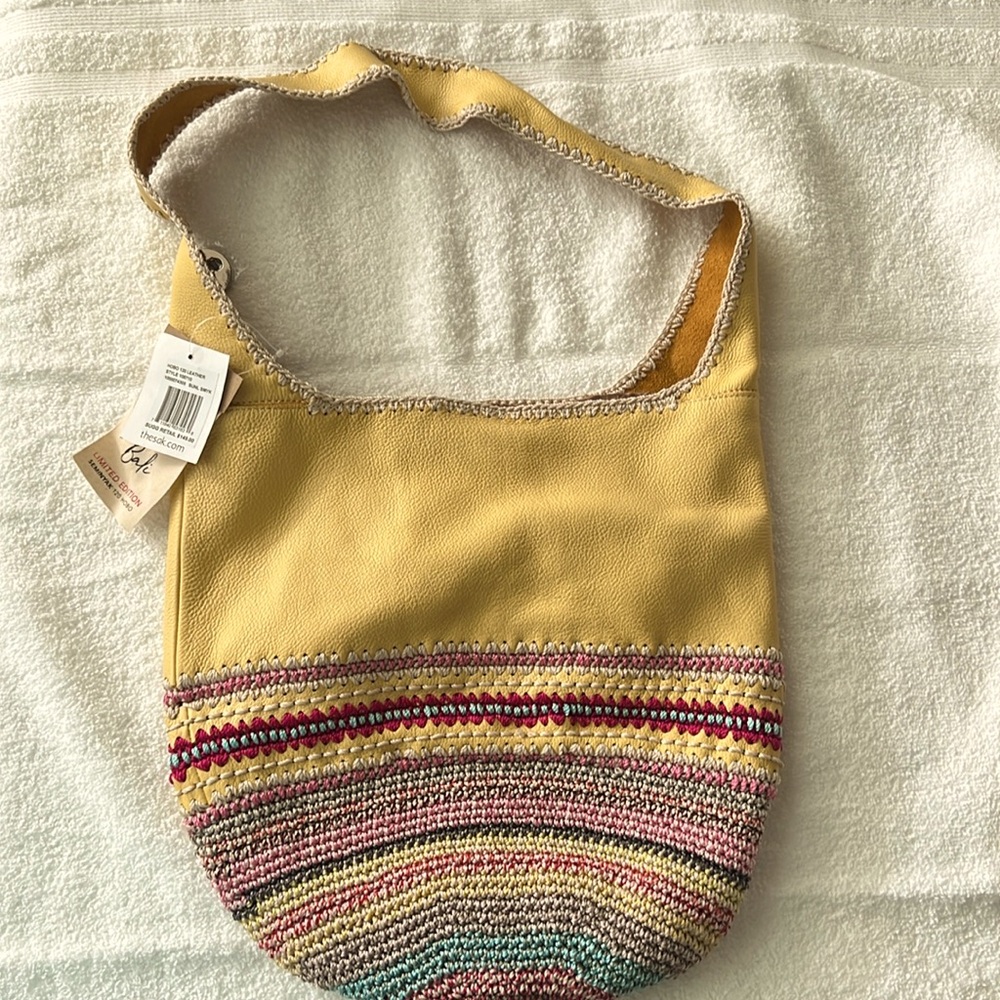The Sak yellow leather Hobo bag. Never used.  Tags still on it.
